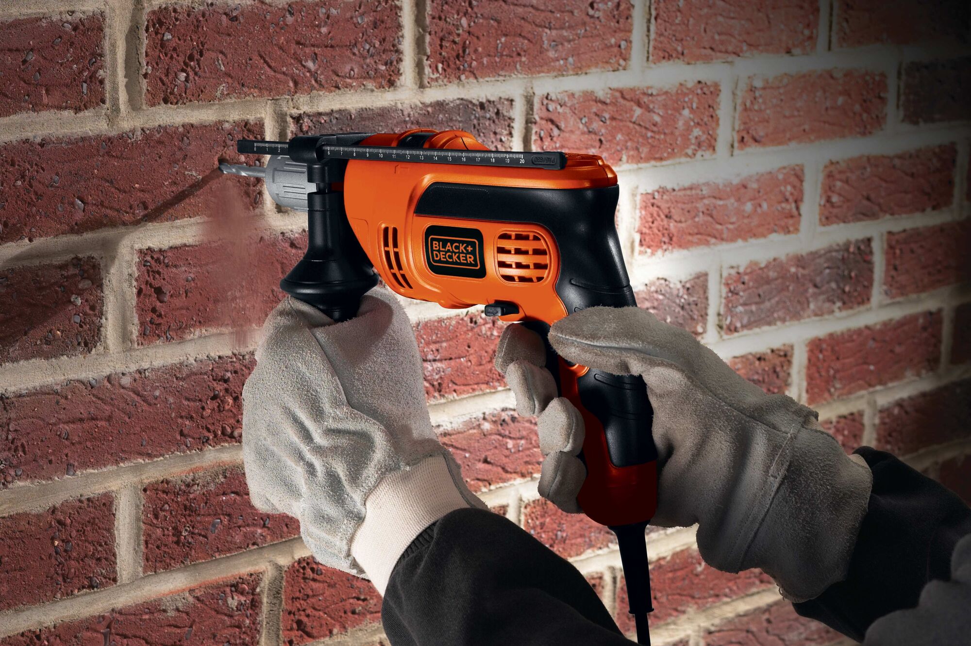 6 Amp half inch Hammer Drill being used for drilling hole in brick wall.