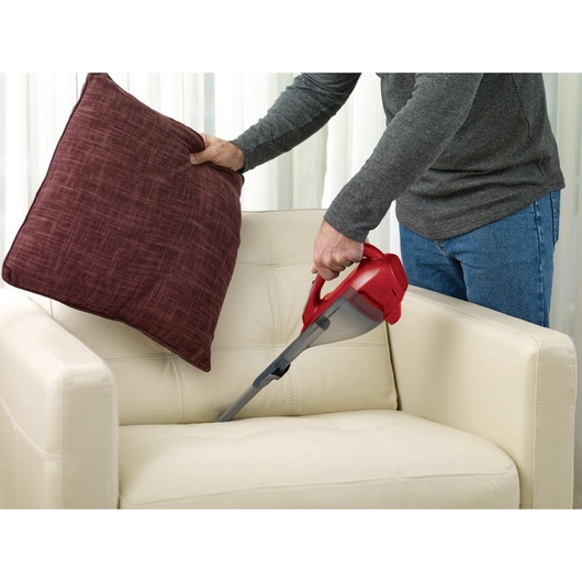Dustbuster advancedclean cordless hand vacuum being used by a person.