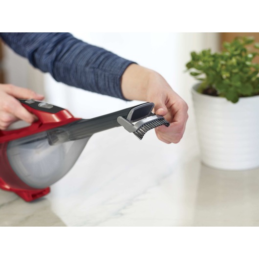Flip up brush feature of Dustbuster Advanced Clean Cordless Hand Vacuum.